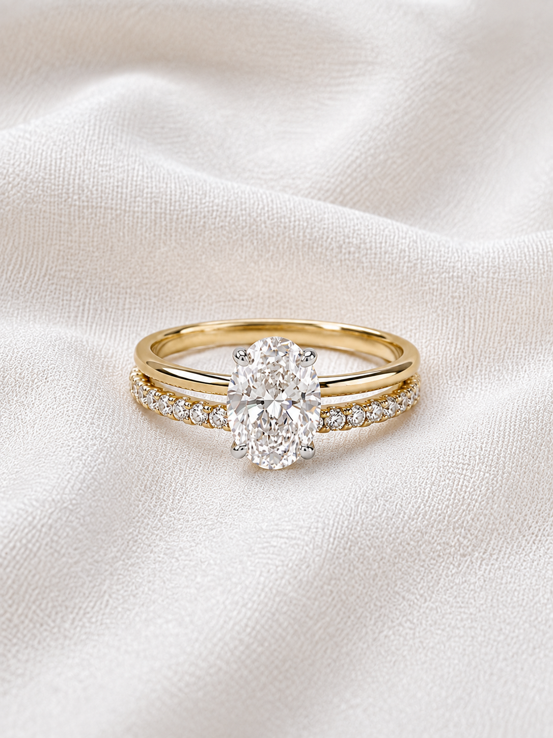 Round brilliant cut and oval Diamond Ring